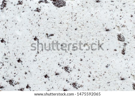 Flatlay view of cookies and cream ice cream background texture.