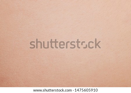 Texture of brown baby skin close up view Royalty-Free Stock Photo #1475605910
