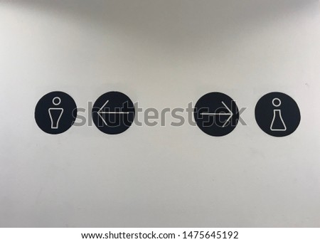 Signpost to the bathroom men and girls