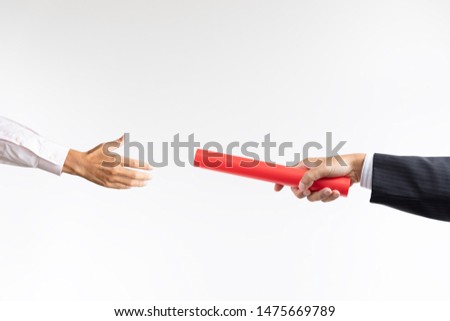 Businessman handing over baton to the next generation Royalty-Free Stock Photo #1475669789