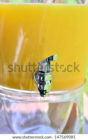 Delicious orange juice in the dispenser