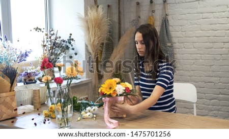 Teacher of floristry in master classes. Process of creating bouquet flower shop close-up. Woman hands and implement. Female florist create beautiful composition in art studio.
