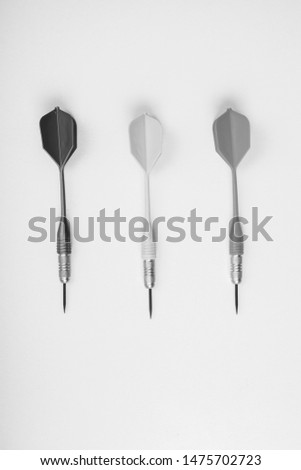 Three darts from a darts on a white background