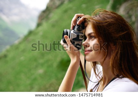 woman takes photos of nature