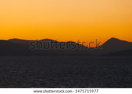 Beautiful colorful sky on the islands of the Saronic Gulf at sunset, Greece