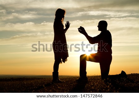 Sunset Marriage Proposal Royalty-Free Stock Photo #147572846