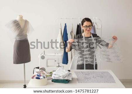 Dressmaker, fashion designer and tailor concept - Fashion designer woman working in the studio
