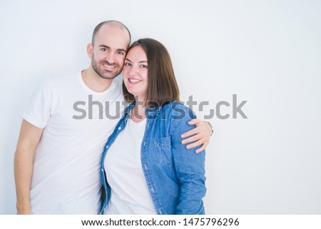 Young couple together over white isolated background with a happy and cool smile on face. Lucky person.