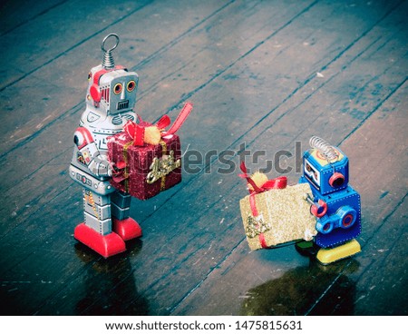 robots at christmas  giving gifts toned image 