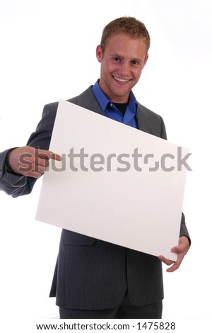 A happy businessman holding a blank sign