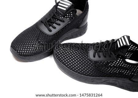 Black sneakers on white background. Classic sport shoes.
