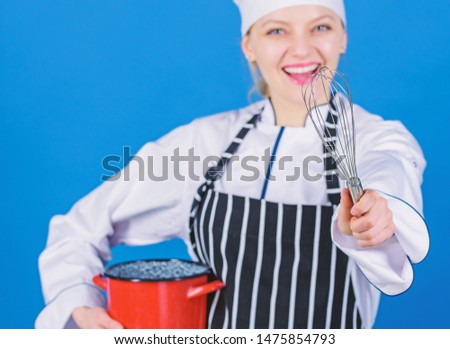Whipping like pro. Girl in apron whipping eggs or cream. Start slowly whisking whipping or beating cream. Use hand whisk. Whipping cream tips and tricks. Woman professional chef hold whisk and pot.