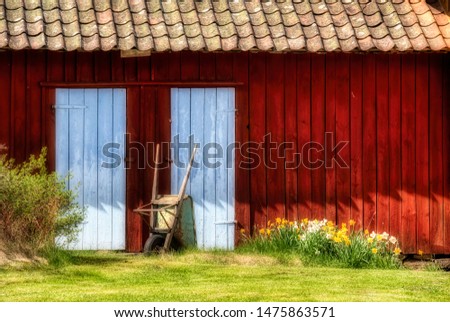 Detail of a Small Barn and an Old Wheelbarrow on Southern Koster Island, Sweden Royalty-Free Stock Photo #1475863571