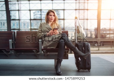 Beautiful woman is waiting for the train