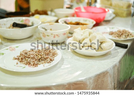 Food preparation for celebration which consists of rice, fish, eggs and others. In this picture is nasi dagang, a popular Malaysian meal on the east coast of the Malaysian Peninsular. 