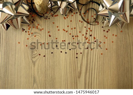 Party background with decorations on wooden table, copy space for your design