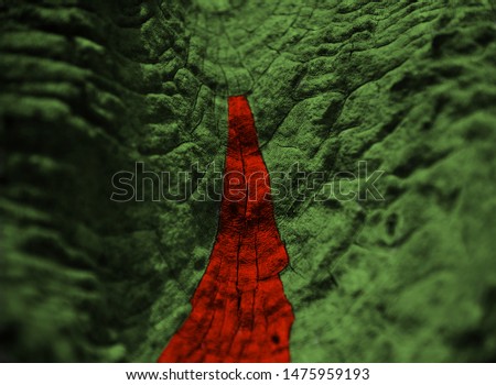 Red and green colours painted on a wooden surface blurry photo