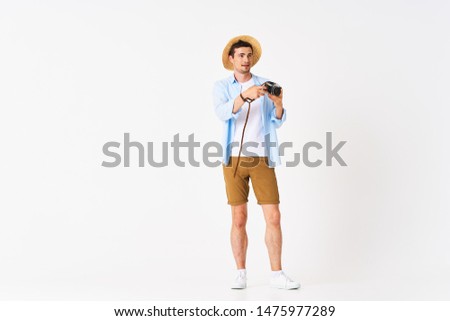 a man in a shirt with a hat on his head