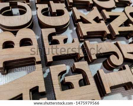 Photograph of letters made of natural pine plywood