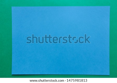 blue paper frame on green background                              