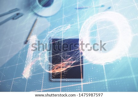 Double exposure of bitcoin drawing on digital tablet on the table background. Concept of blockchain