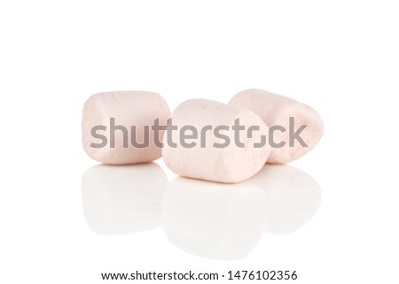 Group of three whole pink sweet fluffy marshmallow isolated on white background