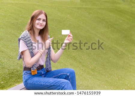 Mockup of female hand holding a kraft paper business card