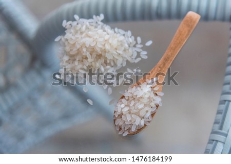Raw rice on a glass table, above vantage point, close up, food photography