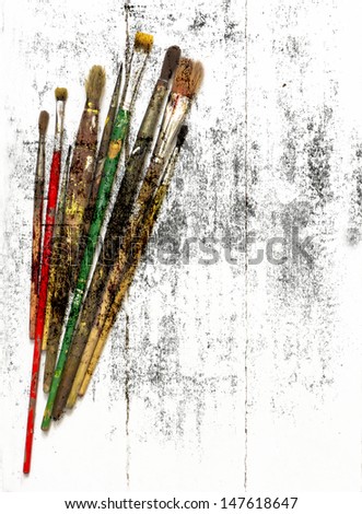Paint brushes on the grunge texture/ Vintage card with old brushe/Arts