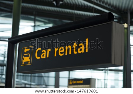 Sign with direction to car rental Royalty-Free Stock Photo #147619601