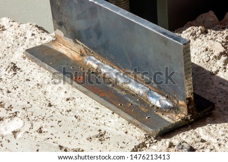 View of the fillet weld and welder test piece. Fillet welding refers to the process of joining two pieces of metal together whether they be perpendicular or at an angle.
