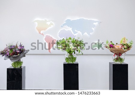 Close up view of beautiful flowers mix in the box. Unpacking and deliver roses. Small business. Floral carpet for Wallpaper. Bouquet of flowers in a glass vase.

