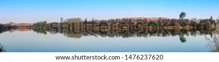 Vaal River Winter landscape wide Panorama with clear sky and calm water mirror reflect banks