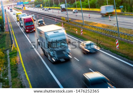 Trucks on four lane controlled-access highway in Poland.
 Royalty-Free Stock Photo #1476252365