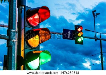 Traffic lights over urban intersection. Red light Royalty-Free Stock Photo #1476252518
