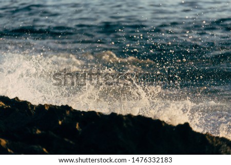 Ocean waves crashing over rocks