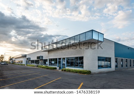 The exterior facade of a generic small business Royalty-Free Stock Photo #1476338159
