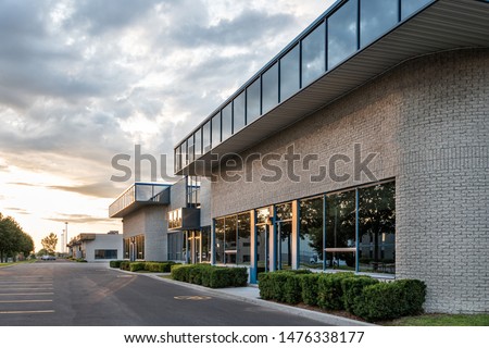 The exterior facade of a generic small business Royalty-Free Stock Photo #1476338177