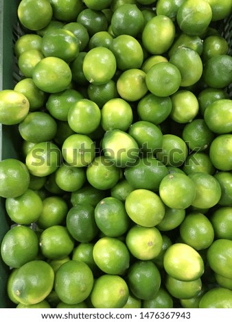 Many of Fresh Green Lemons background

