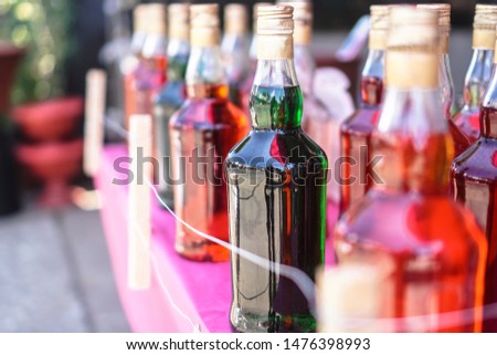Multicolored bottled drinks outside. Stock photo background