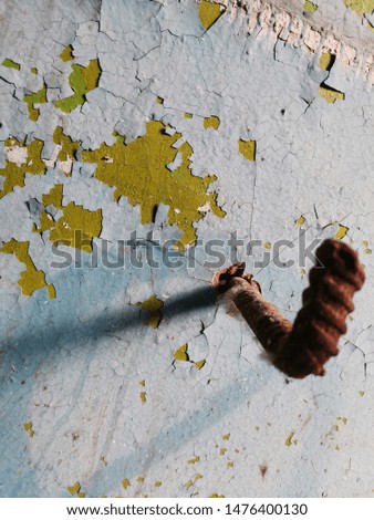 photo of an old painted wall with the texture of cracked paint