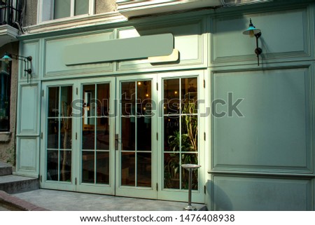 Front view cafe shop & restaurant design.modern loft board water green.wall concrete.windows black metal frame-3d render