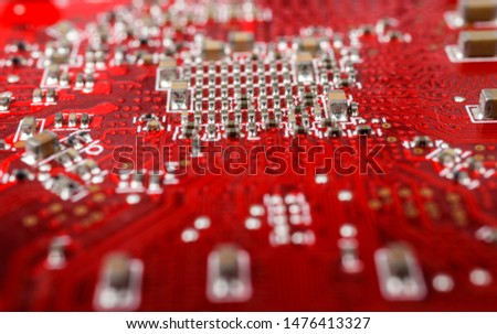 Graphic card. Part of red graphic card as background. Technology and Electronics Industry. Macro.