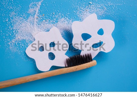 tooth brush on blue background with bacteria on it