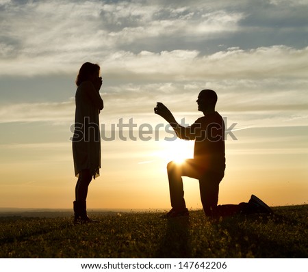 Sunset Marriage Proposal Royalty-Free Stock Photo #147642206