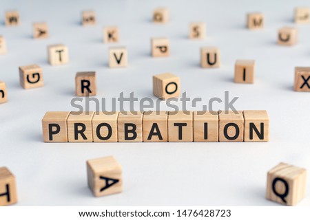 probation - word from wooden blocks with letters, period of time criminal is allowed to stay out of prison or period a new employee is suitable for work concept, random letters around Royalty-Free Stock Photo #1476428723