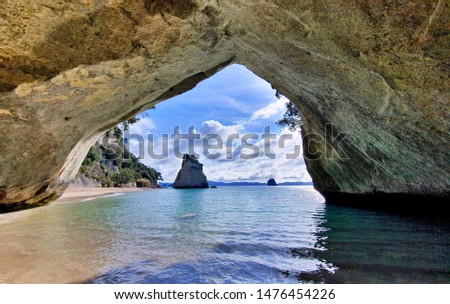 Famous Cathedral Cove in Coromandel Peninsula, New Zealand. Winter 2019, picture taken on a bright day, almost no tourists around. Absolute paradise. Sandy beach.