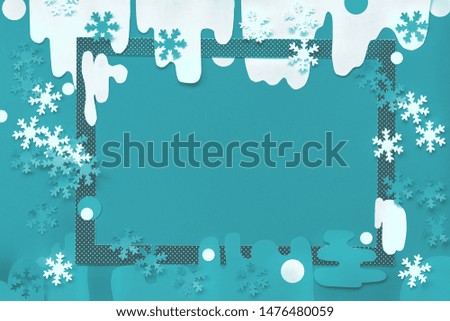 Concept top view flat lay winter background with brush loaded with paper snowflakes, toned image