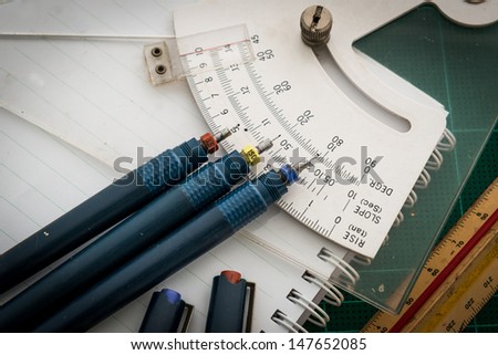 Green Cutting mats , Pen drawings , adjust angle tool , scale ruler , cutter  on the white background