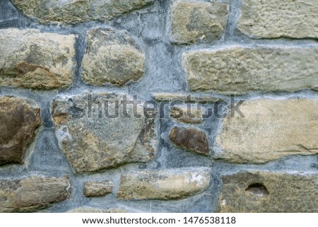 texture of masonry, the fragment of a stone wall of an ancient temple of the 10th century, background, backdrop